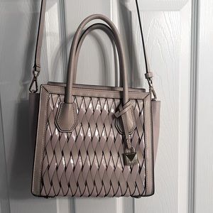 Mauve with gold zipper and lock